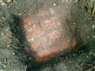 Close-up of a portion of a brick foundation or column