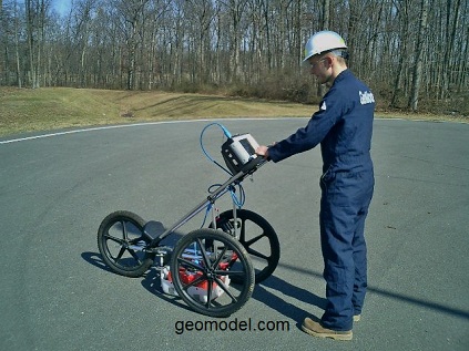 GeoModel operator using the GPR cart to move the antenna over the site